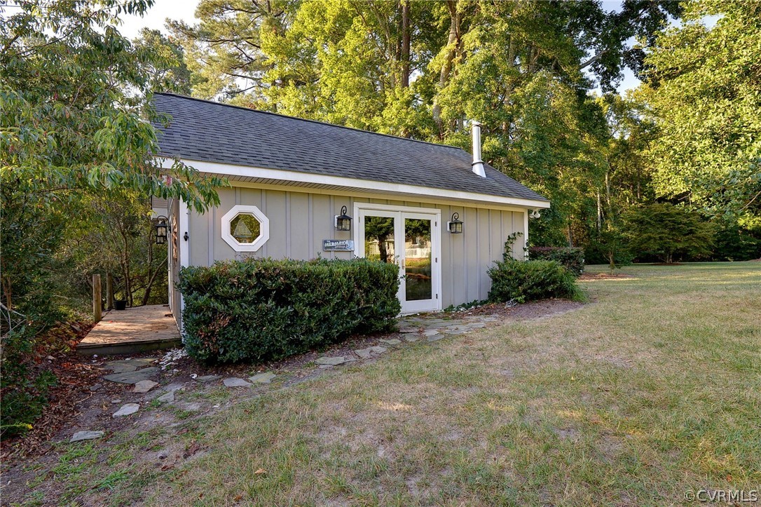 1020 Pine Hall Road Mathews, VA 23109 - Photo 39 of 49 a view of a house with a yard plants and large tree