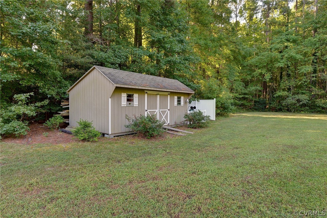 1020 Pine Hall Road Mathews, VA 23109 - Photo 46 of 49 a view of a house with backyard and garden