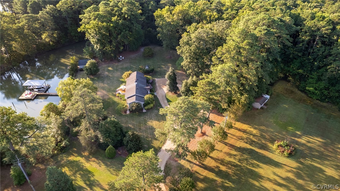 1020 Pine Hall Road Mathews, VA 23109 - Photo 49 of 49 a backyard of a house with a yard and outdoor seating