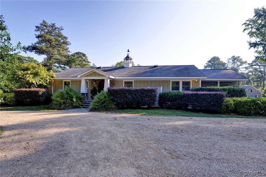 1020 Pine Hall Road Mathews, VA 23109 - Photo 6 of 49 a front view of a house with a yard and garage