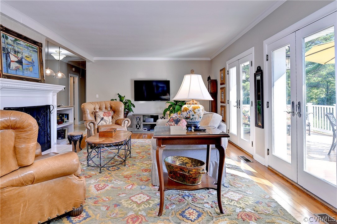 1020 Pine Hall Road Mathews, VA 23109 - Photo 9 of 49 a living room with furniture a fireplace and a flat screen tv