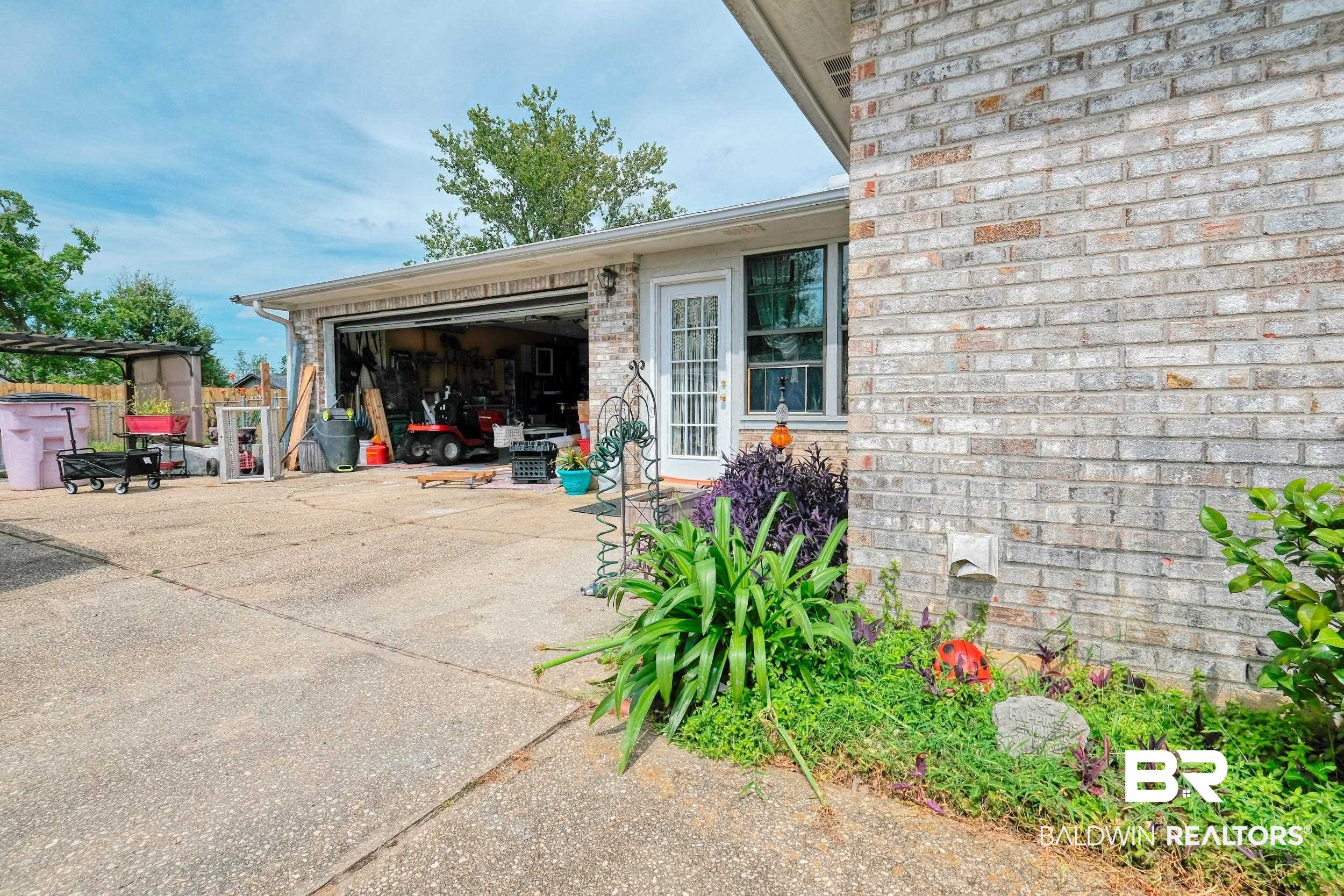 504 Ariel Avenue Foley, AL 36535 - Photo 10 of 33 Exterior space featuring a garage