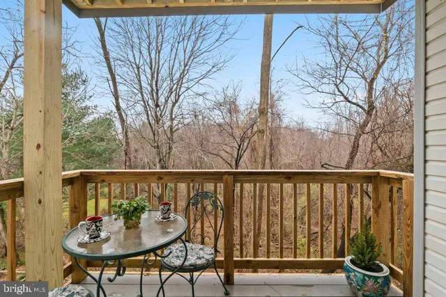 a view of a balcony with wooden fence