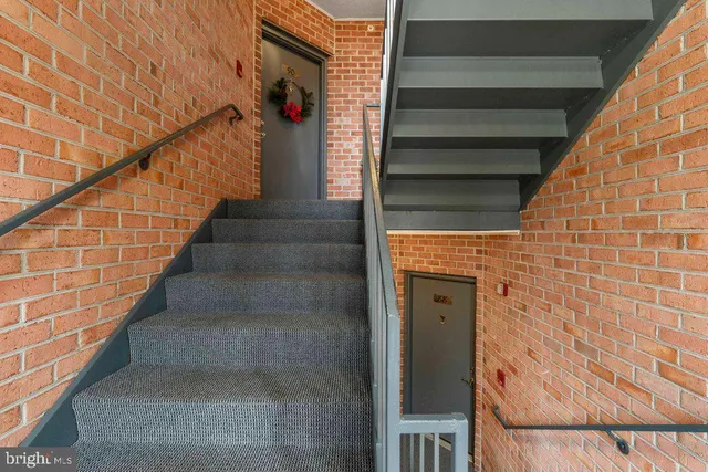 a view of entryway with a small yard