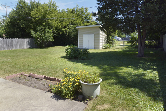 370 Dunbar Road Wauconda, IL 60084 - Photo 21 of 22 a view of a backyard with plants and large tree