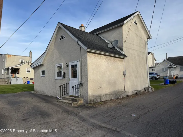 a view of a house with a street