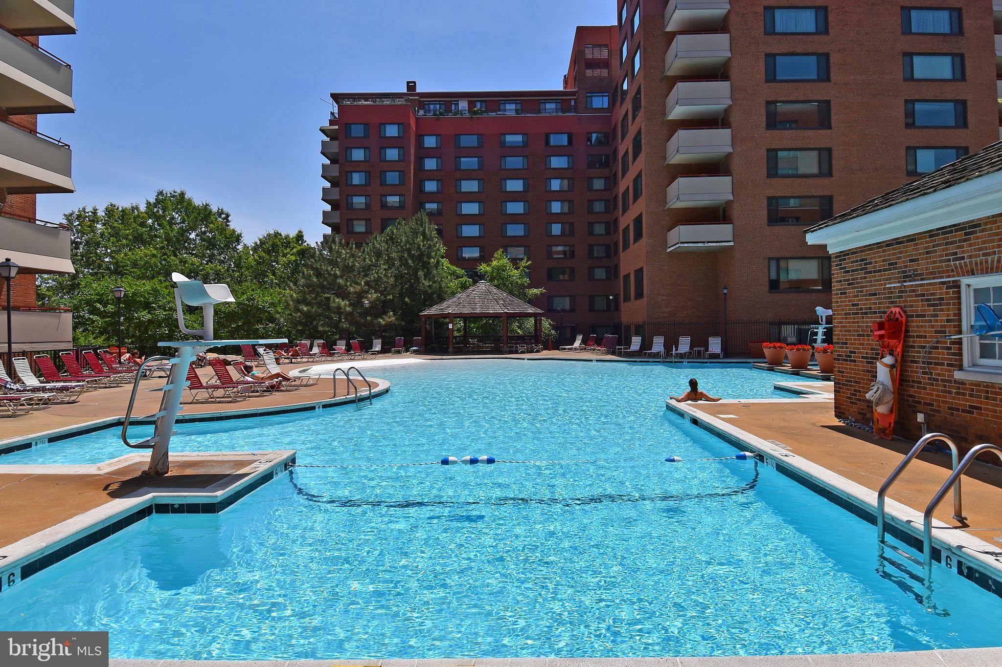 a view of a swimming pool with a lounge chairs