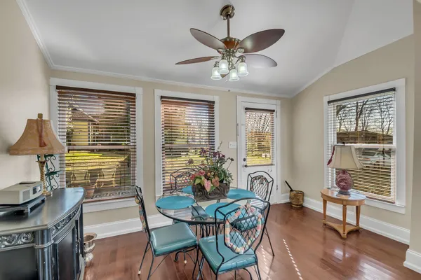 a view of a dining room with furniture window and wooden floor