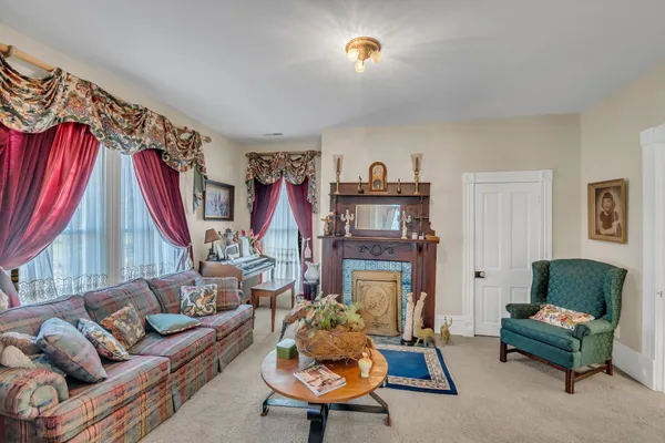 a living room with furniture and a fireplace