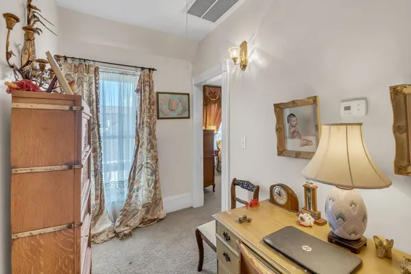 a room with a window and a mirror