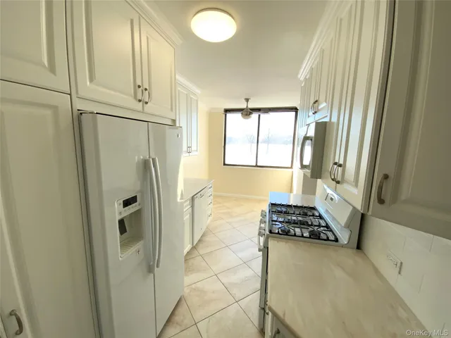 a walk in closet and window in a room