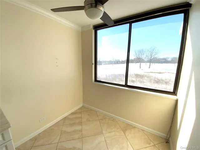 a view of a room with a large window