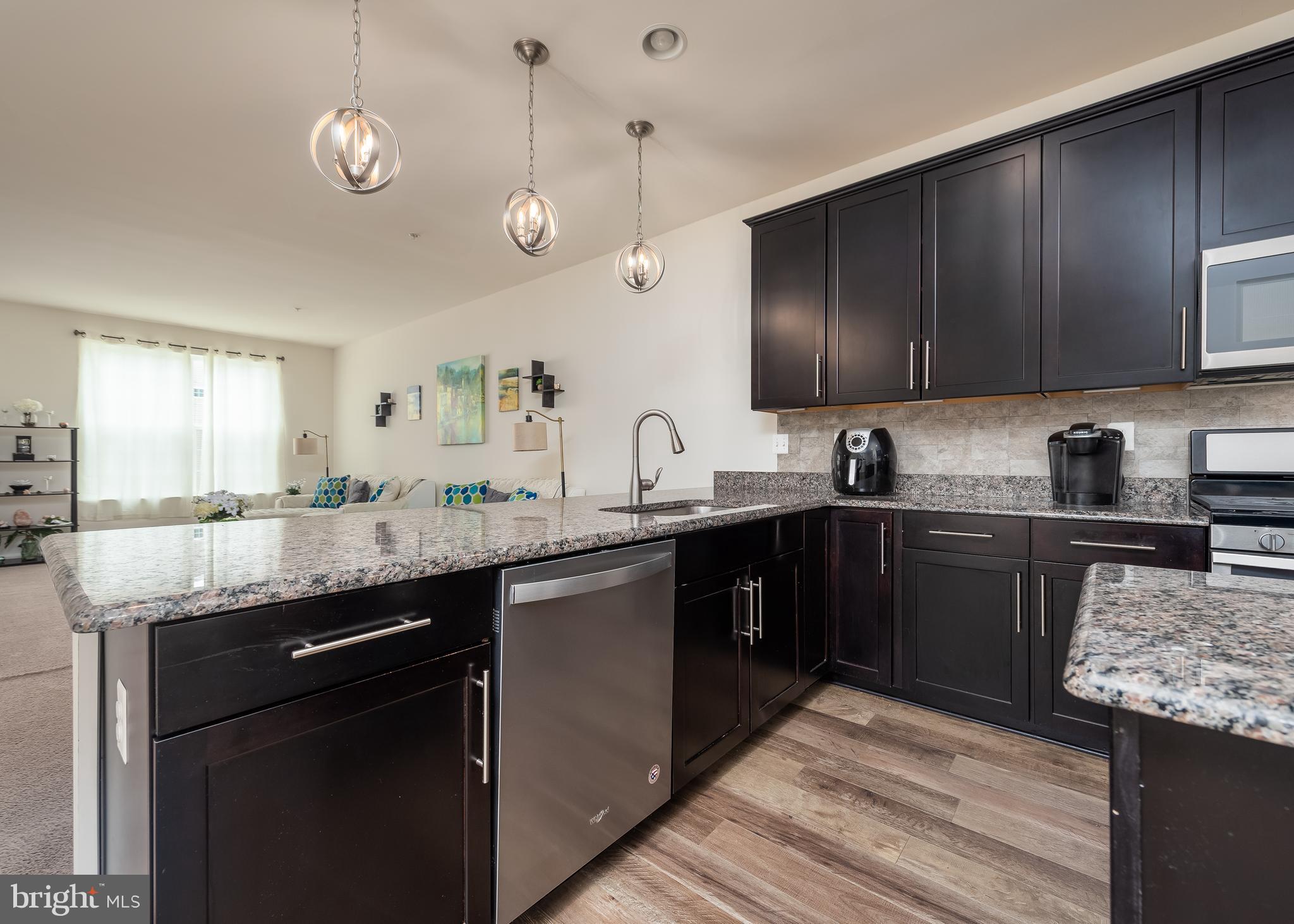 9780 Peace Spgs Ridge Laurel, MD 20723 - Photo 8 of 30 Cherry cabinets and granite countertops