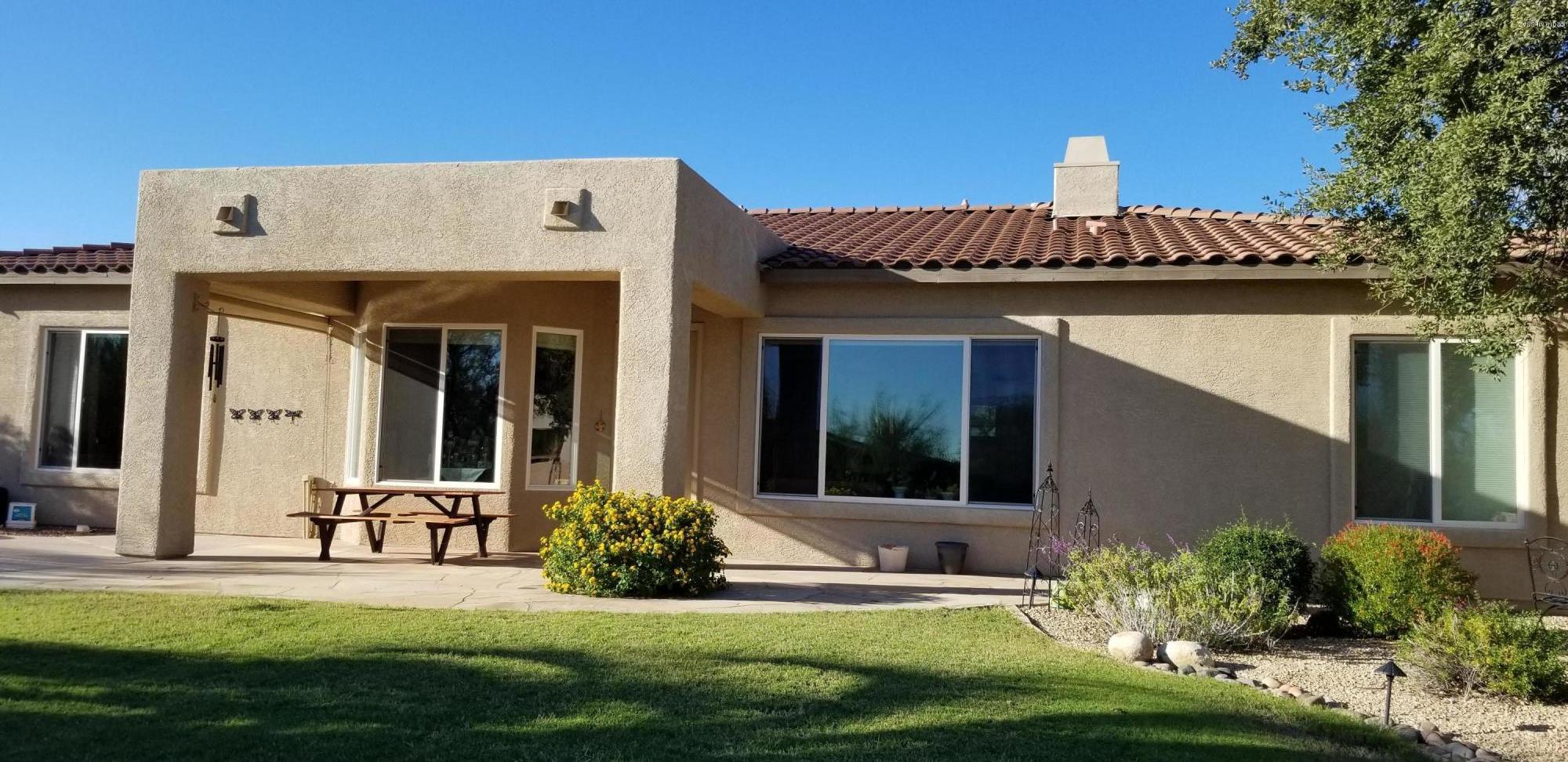 12682 North Spirit Mountain Road Oro Valley, AZ 85755 - Photo 18 of 40 a view of a house with backyard sitting area and garden