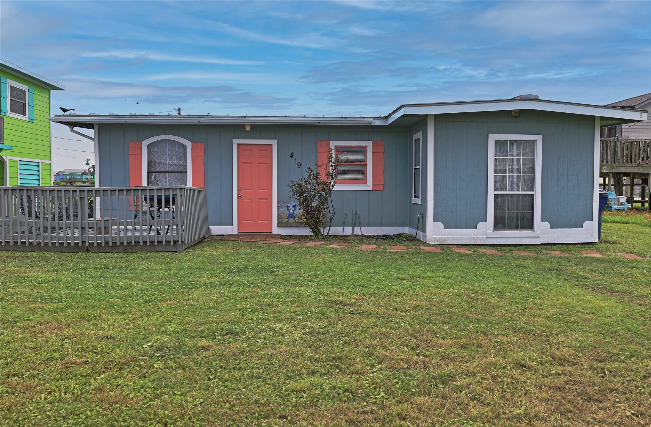 419 Murex Street Surfside Beach, TX 77541 - Photo 1 of 17 a front view of a house with garden