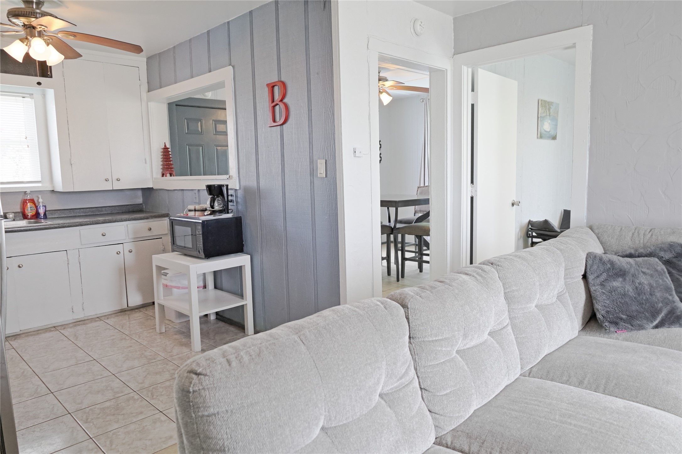 419 Murex Street Surfside Beach, TX 77541 - Photo 7 of 17 a living room with a couch and a view of kitchen