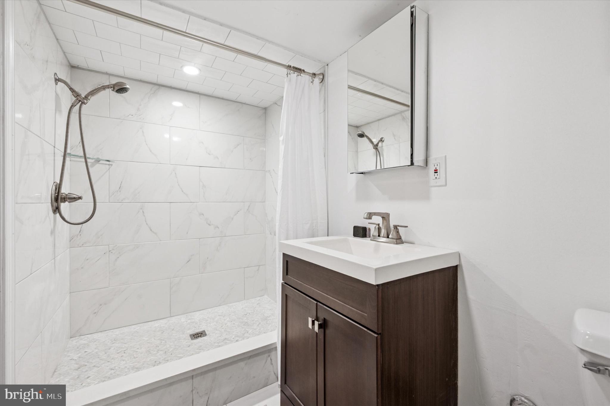 1131 Divinity Street Philadelphia, PA 19143 - Photo 29 of 38 Second full bathroom with tastefully tiled shower.