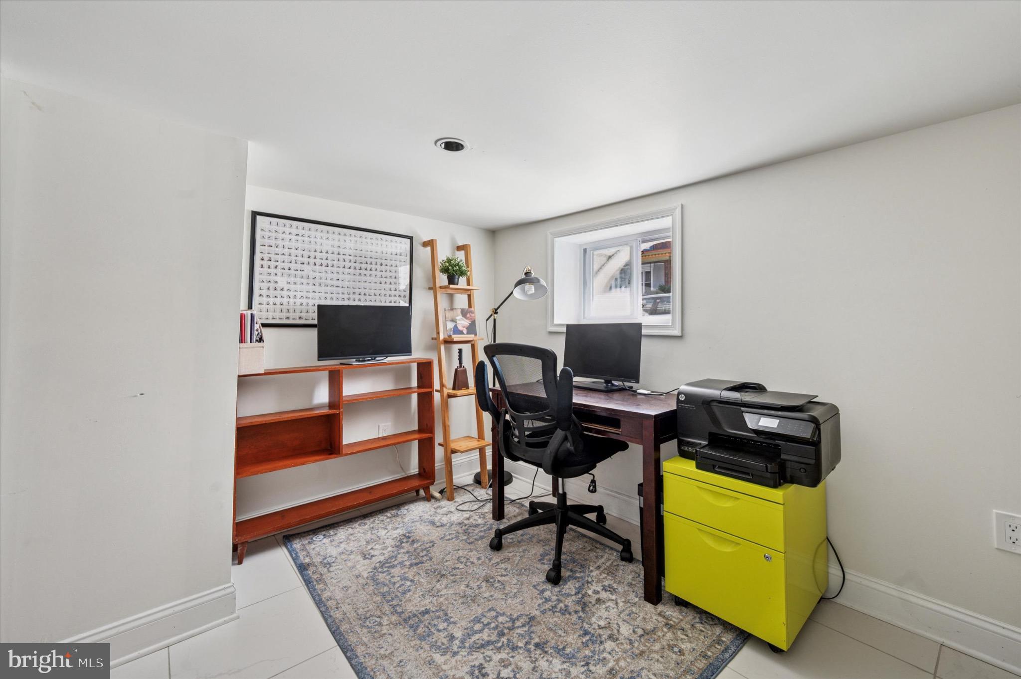 1131 Divinity Street Philadelphia, PA 19143 - Photo 31 of 38 Front room of basement with ample natural light.