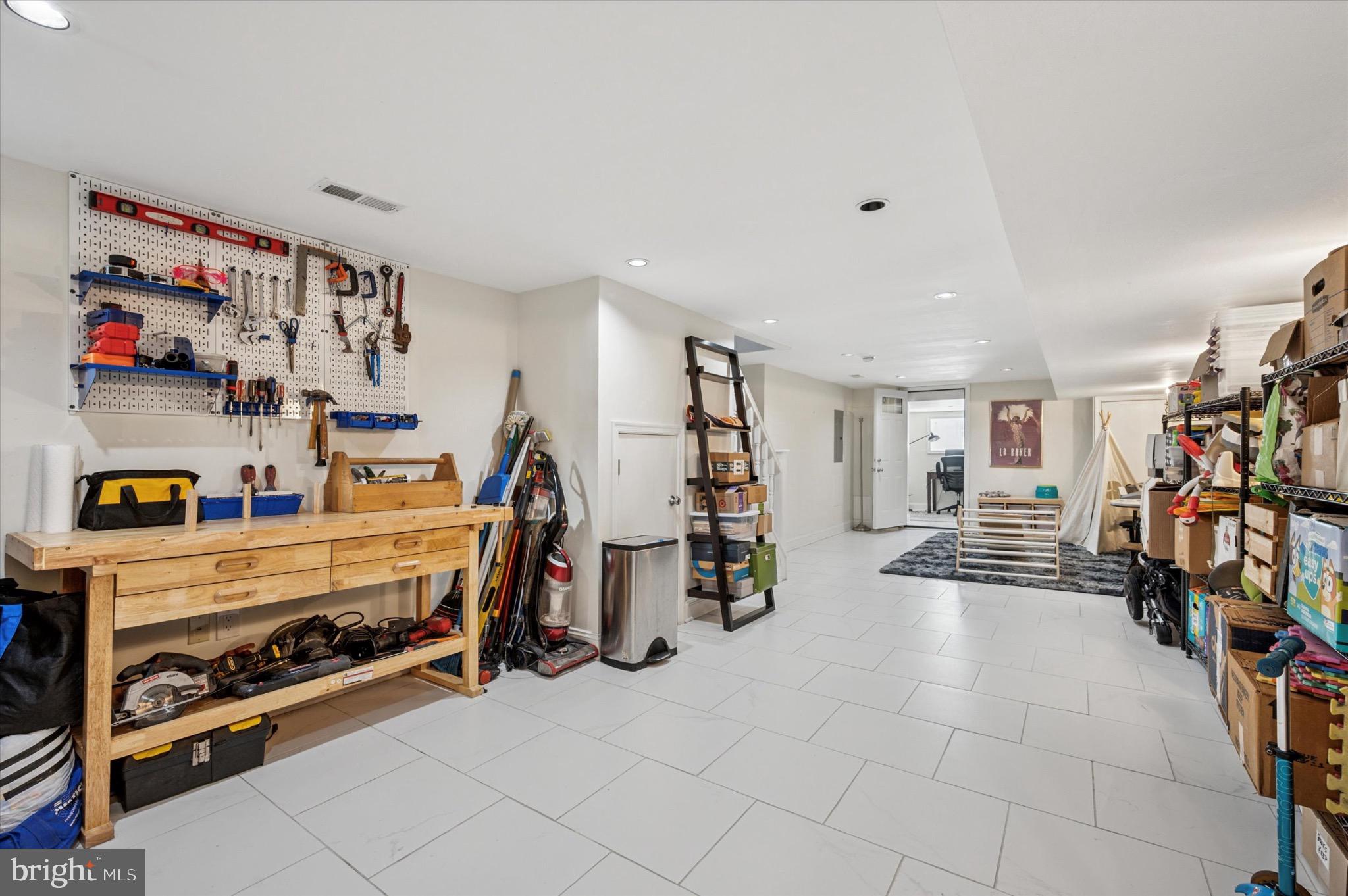 1131 Divinity Street Philadelphia, PA 19143 - Photo 32 of 38 Spacious, bright, and versatile finished basement.