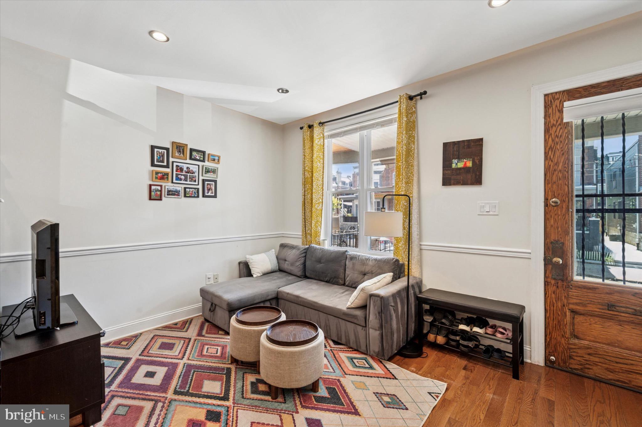 1131 Divinity Street Philadelphia, PA 19143 - Photo 6 of 38 Cozy living space with vibrant accents.