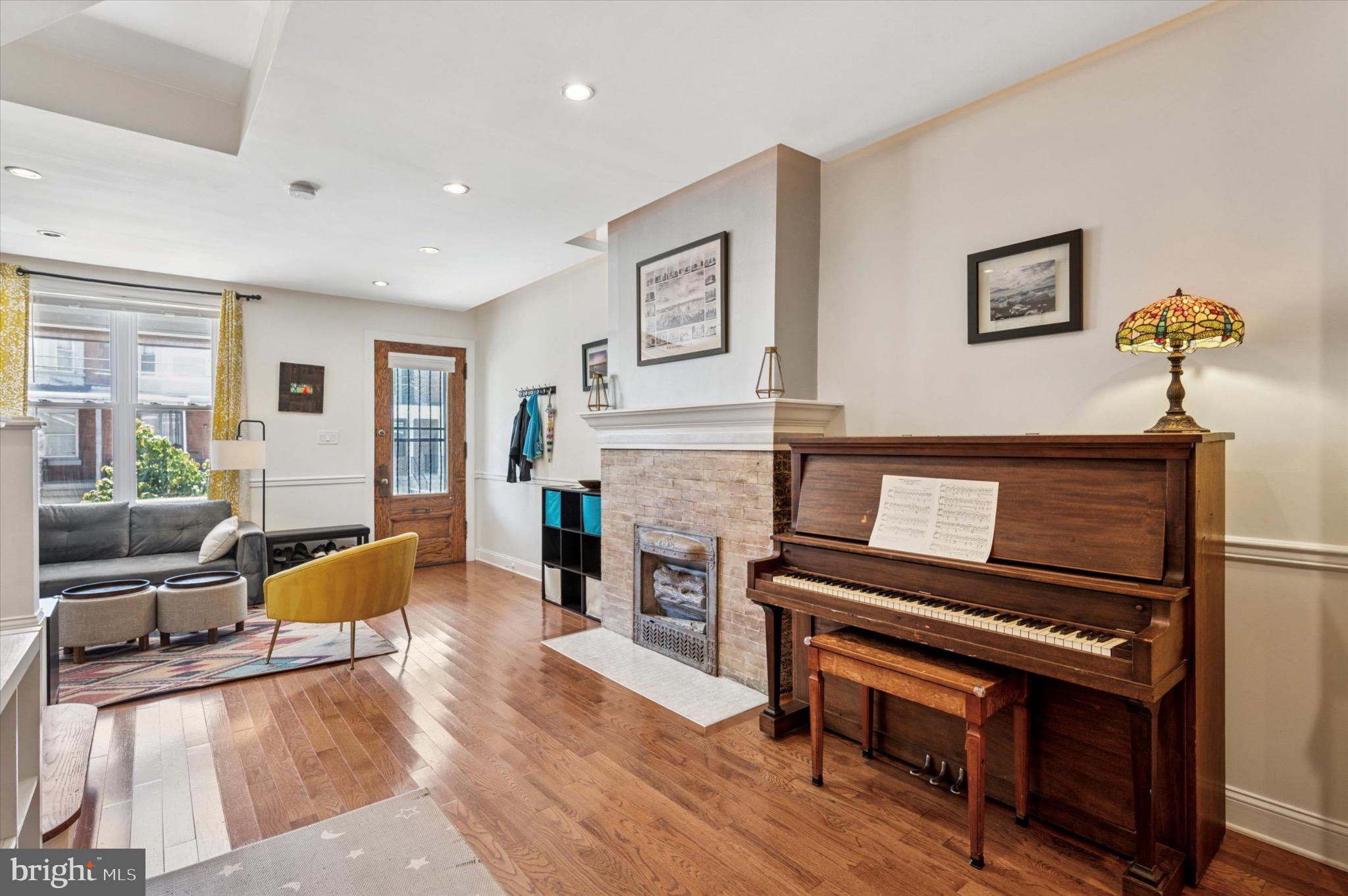 1131 Divinity Street Philadelphia, PA 19143 - Photo 8 of 38 Charming living space with a classic piano.