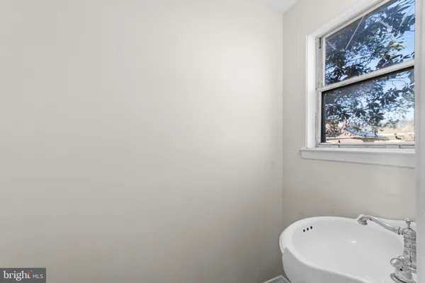 a bathroom with a sink and mirror