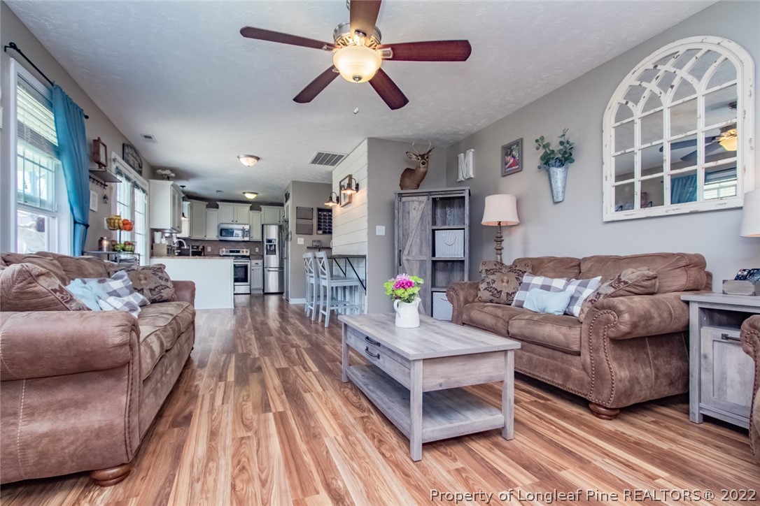 471 United Road Raeford, NC 28376 - Photo 13 of 31 a living room with furniture and a wooden floor