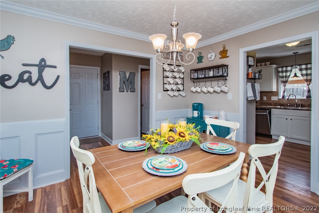 471 United Road Raeford, NC 28376 - Photo 10 of 31 a view of a dining room with furniture kitchen and wooden floor