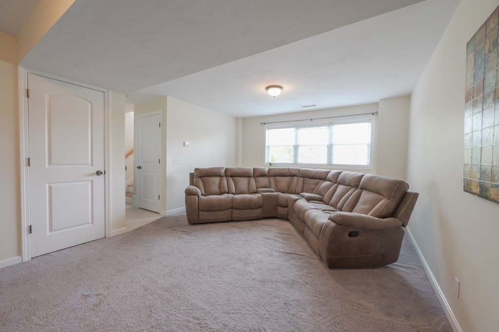 408 Sunderland Road Worcester, MA 01604 - Photo 12 of 24 a living room with furniture and a window