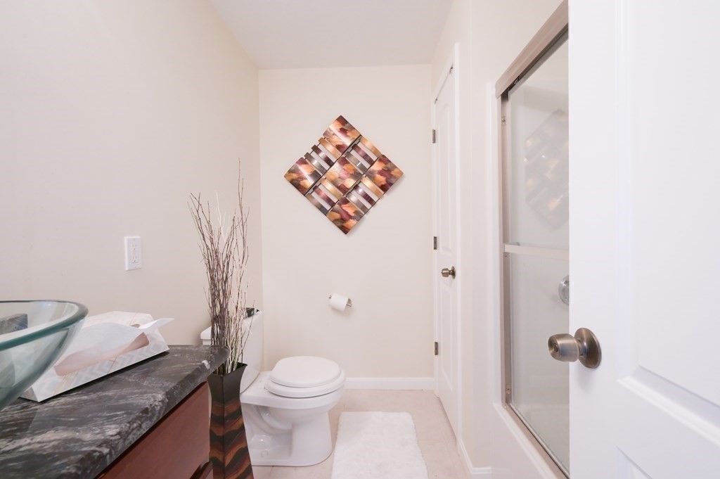 408 Sunderland Road Worcester, MA 01604 - Photo 13 of 24 a white toilet sitting next to a bathroom sink