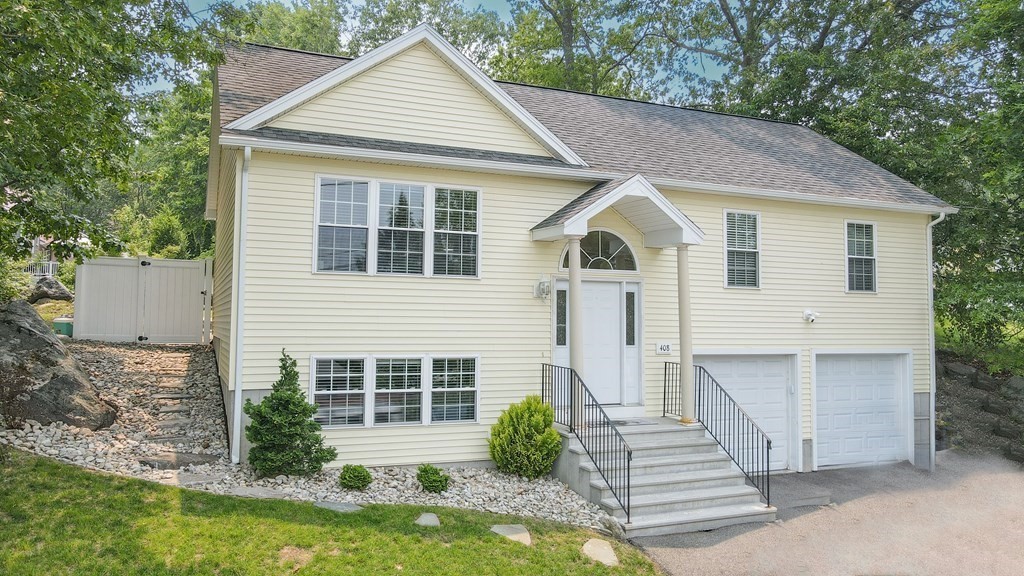 408 Sunderland Road Worcester, MA 01604 - Photo 2 of 24 a view of a house with yard and plants