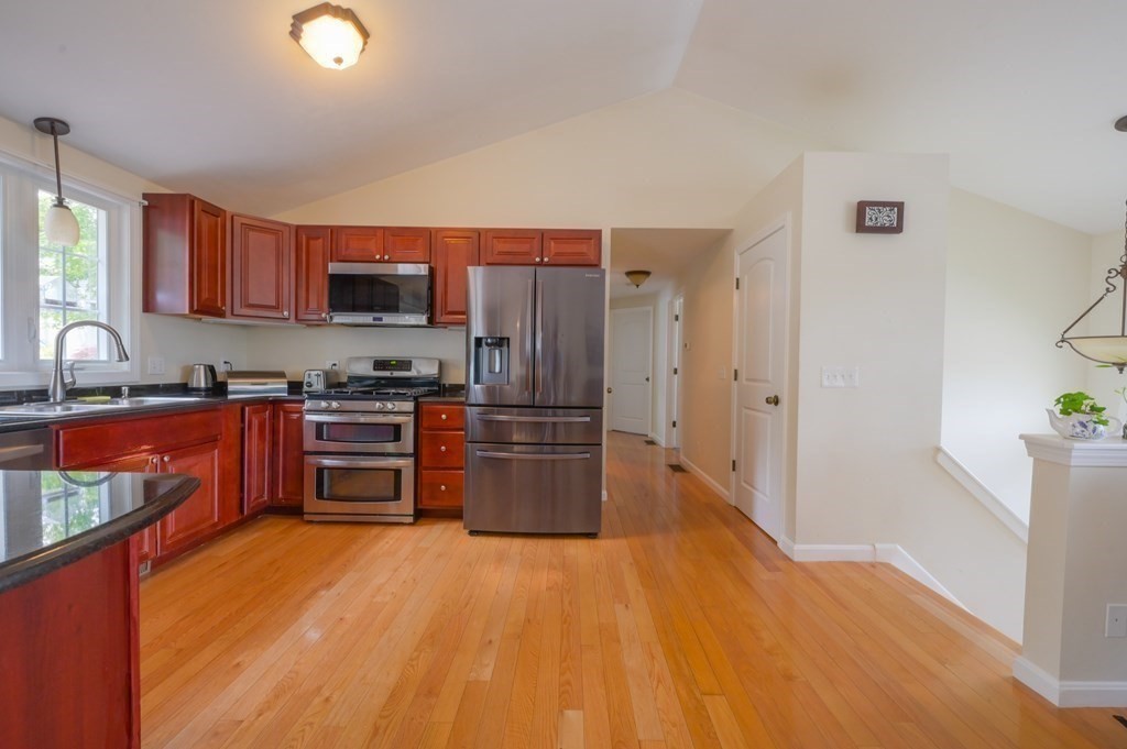 408 Sunderland Road Worcester, MA 01604 - Photo 3 of 24 a kitchen with stainless steel appliances a refrigerator and a sink
