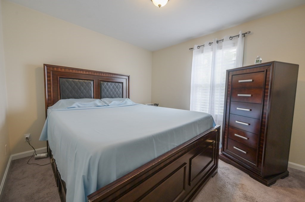 408 Sunderland Road Worcester, MA 01604 - Photo 9 of 24 a room with a bed and dresser