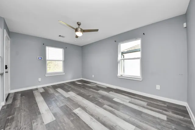 a view of an empty room with a window