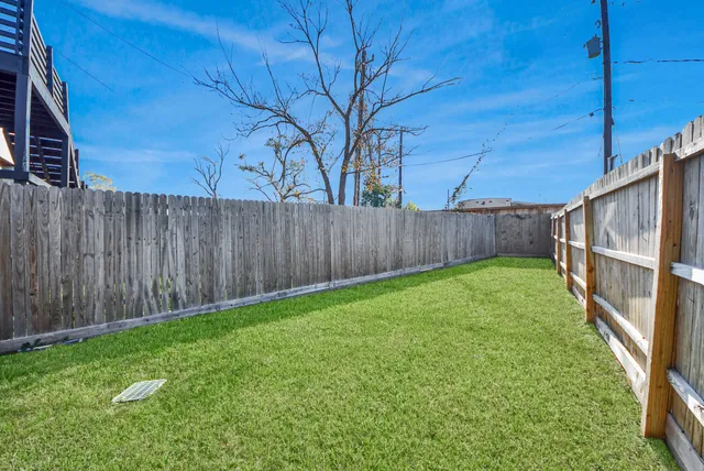 a view of a yard with potted plants