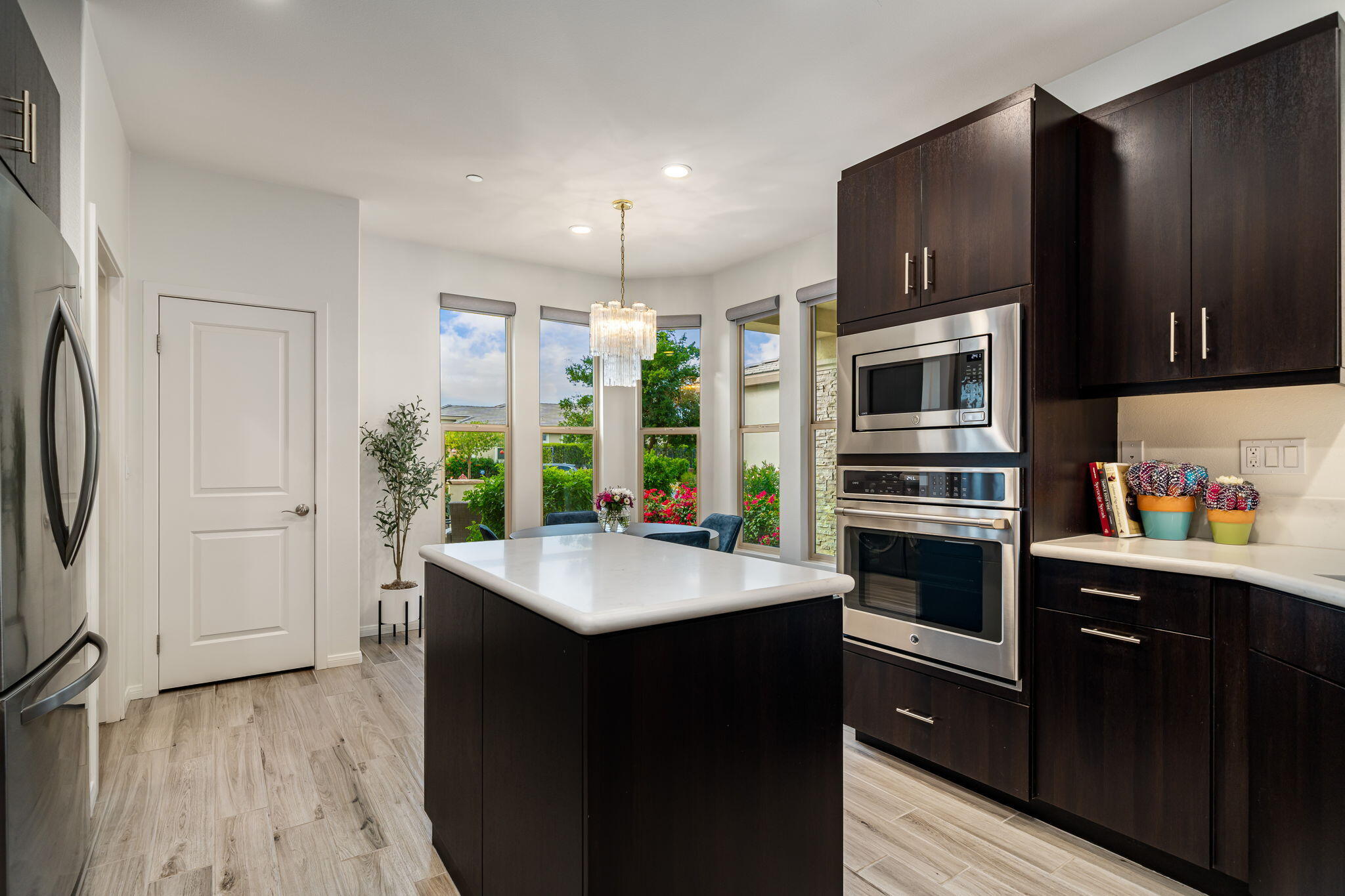 51270 North Two Palms Way Indio, CA 92201 - Photo 21 of 43 a kitchen with stainless steel appliances a sink stove and refrigerator