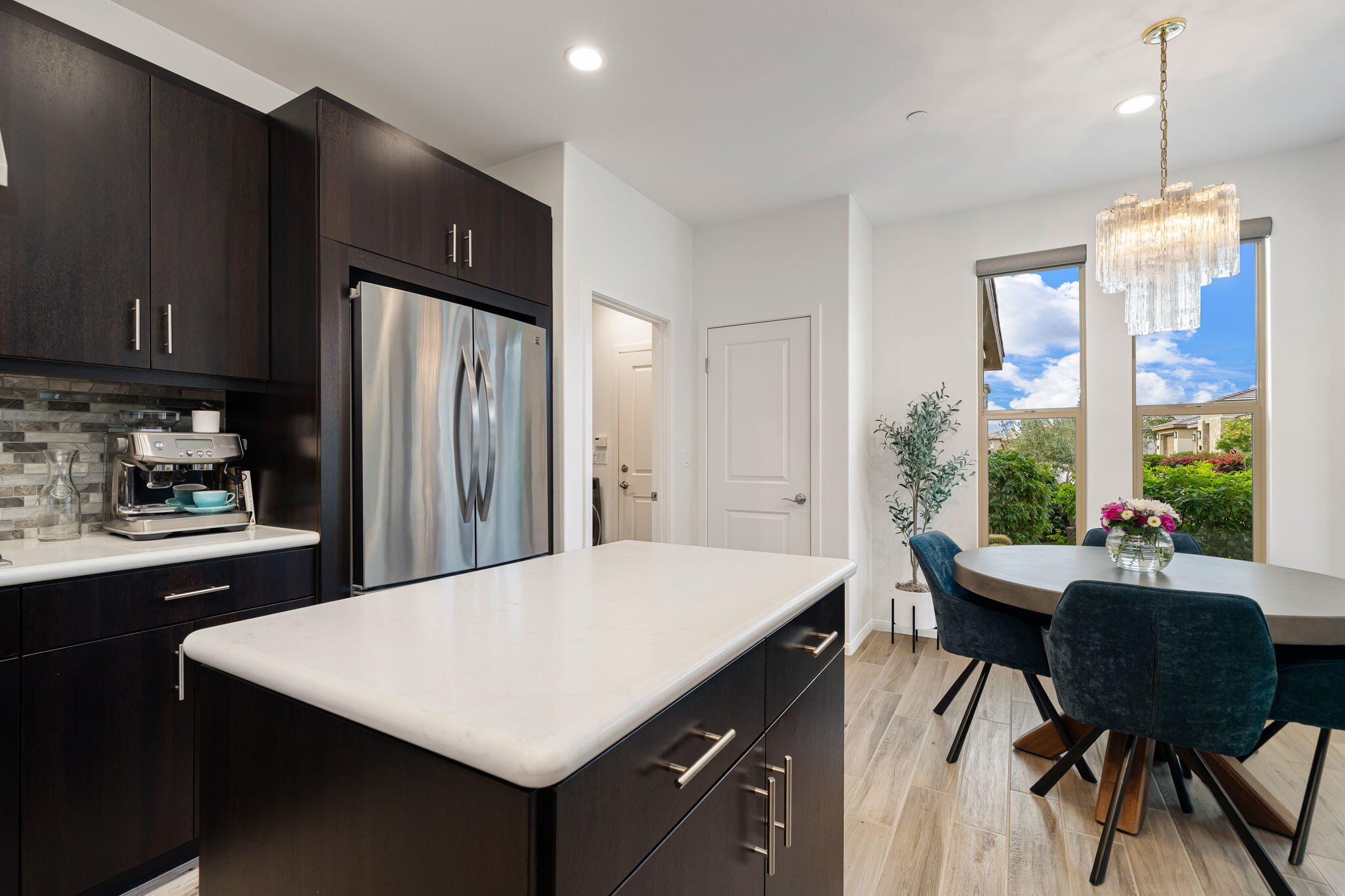 51270 North Two Palms Way Indio, CA 92201 - Photo 22 of 43 a kitchen with a table chairs and refrigerator