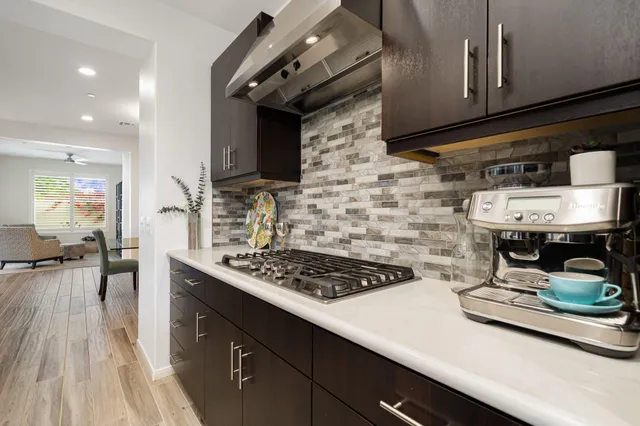 a kitchen with a stove and cabinets