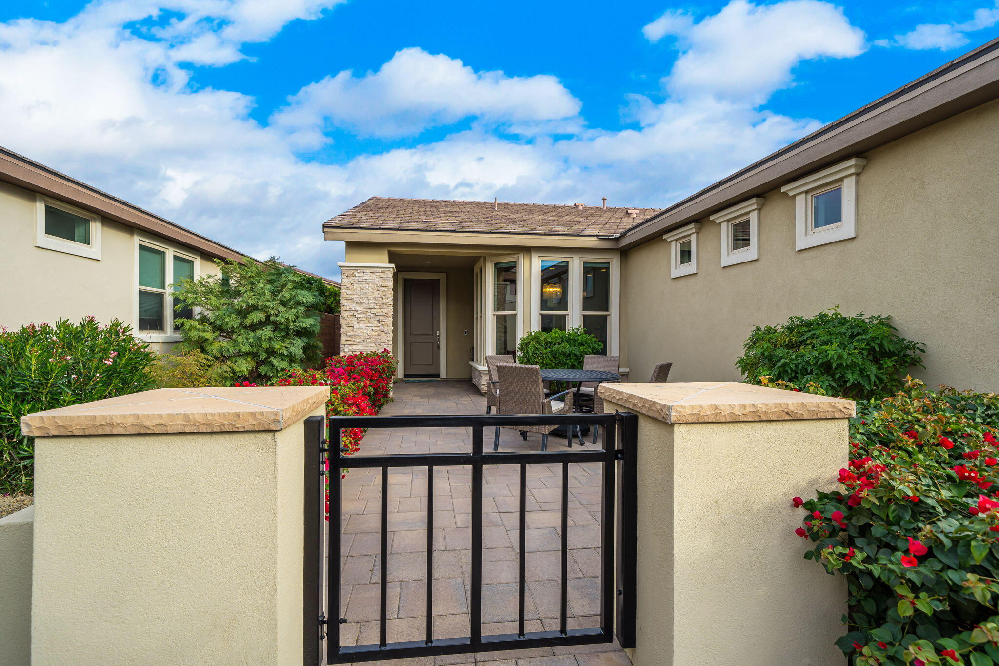 51270 North Two Palms Way Indio, CA 92201 - Photo 5 of 43 a view of outdoor kitchen and front view of a house