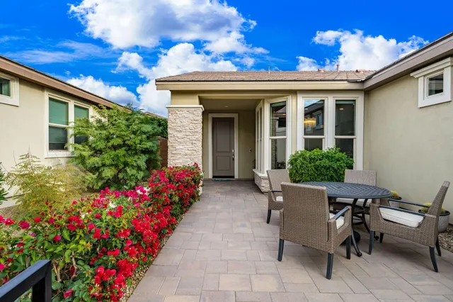 a view of a house with an outdoor seating