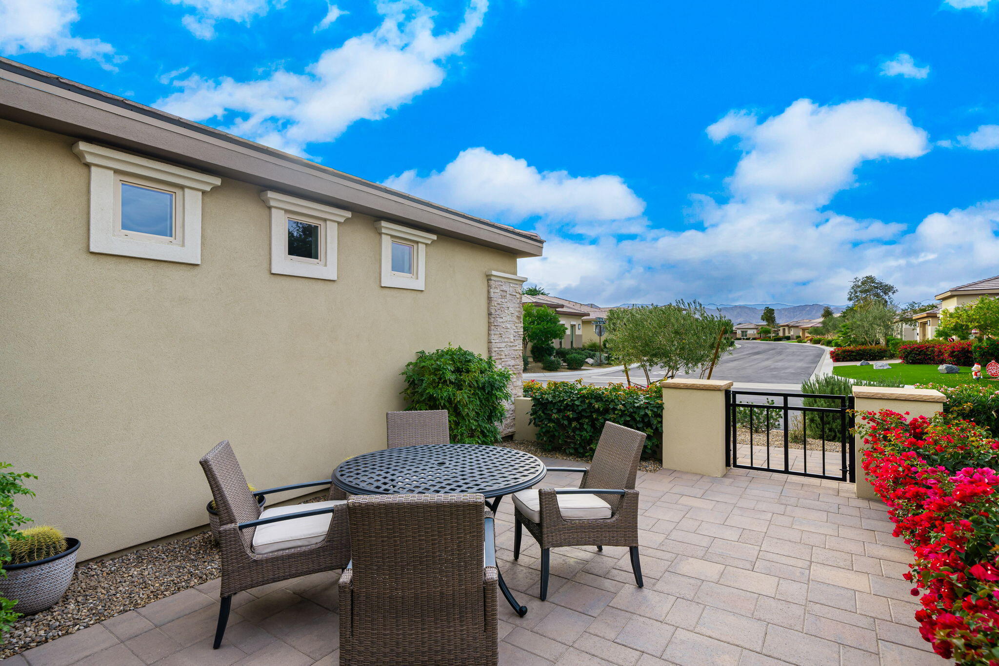 51270 North Two Palms Way Indio, CA 92201 - Photo 7 of 43 a view of a patio with couches table and chairs and potted plants