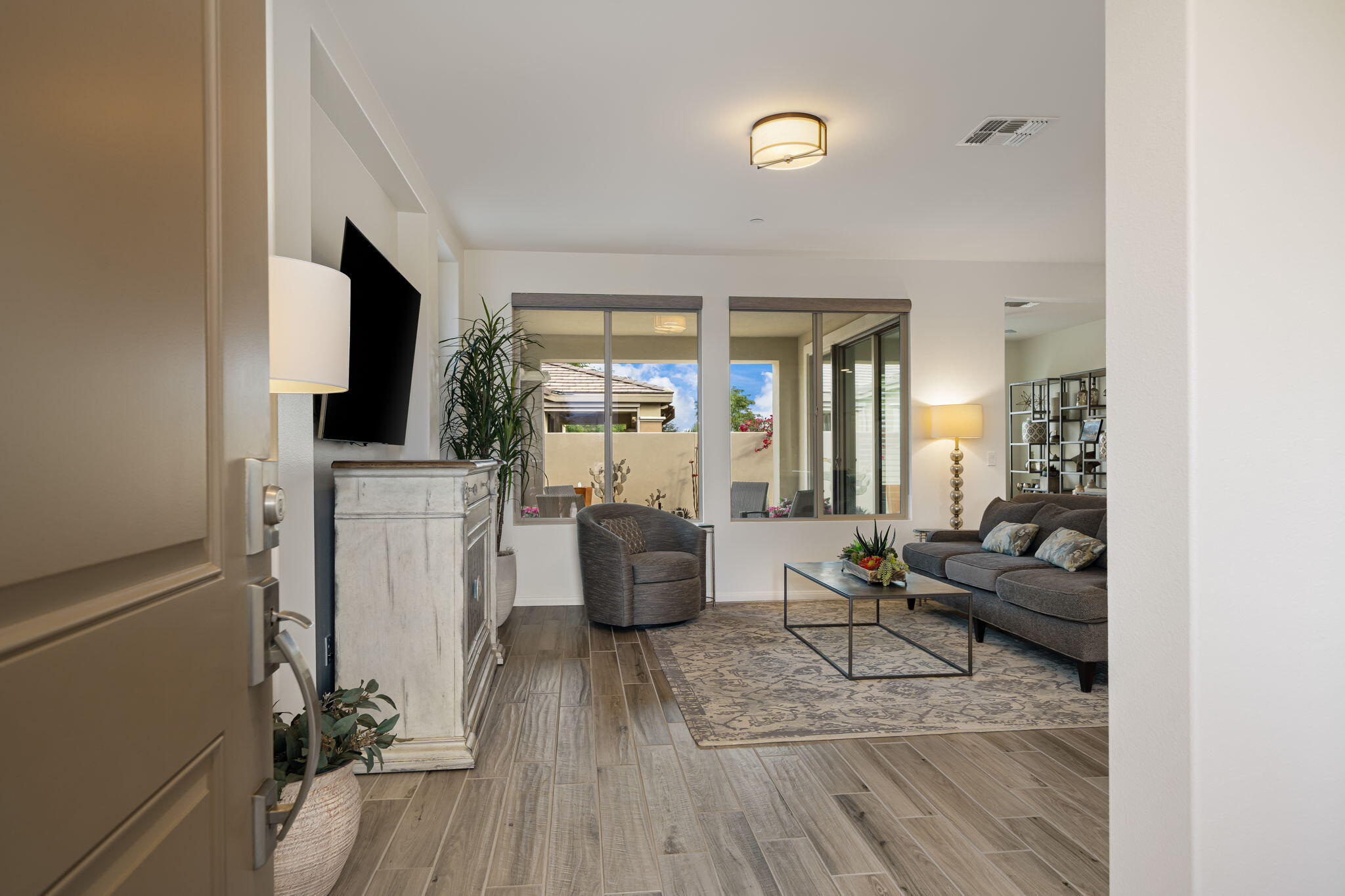 51270 North Two Palms Way Indio, CA 92201 - Photo 10 of 43 a living room with furniture and a flat screen tv