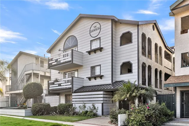 a view of multiple house with a yard