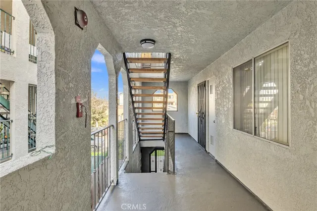 a view of a hallway with windows