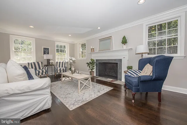 a living room with furniture rug and window