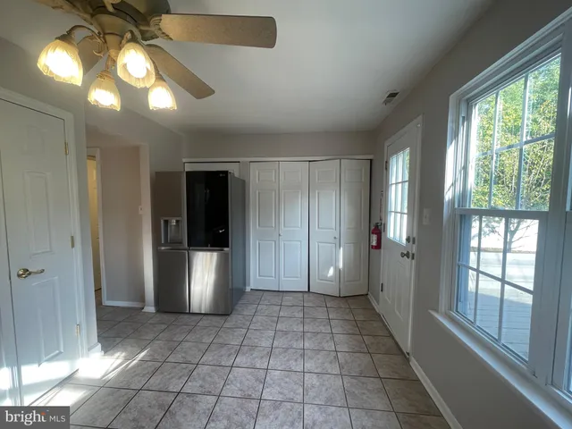 a bathroom with a glass door shower and a sink