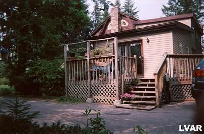 0 Hc Gilbert, PA 18331 - Photo 2 of 17 a view of a house with wooden fence