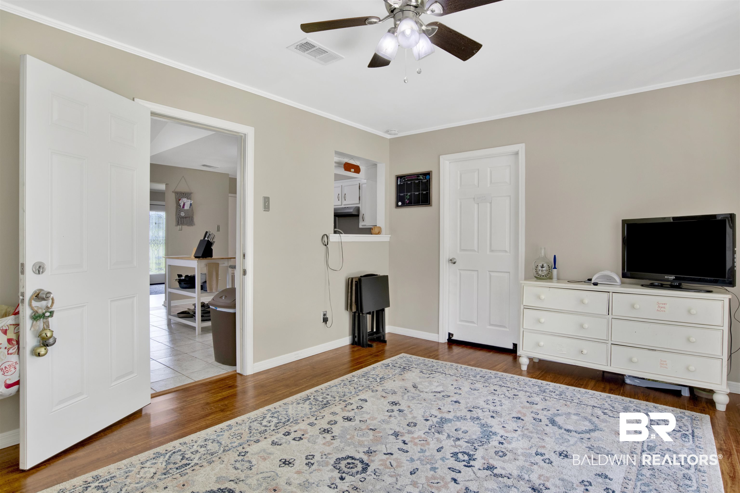 1476 Boudousquie Street Mobile, AL 36605 - Photo 24 of 34 Bedroom with wood finished floors, crown molding, and ceiling fan