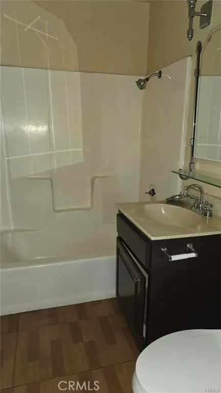 308 North Millard Avenue Rialto, CA 92376 - Photo 11 of 11 a bathroom with a sink a toilet and shower
