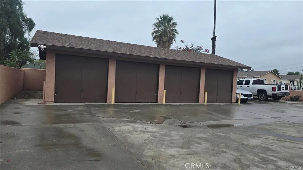 308 North Millard Avenue Rialto, CA 92376 - Photo 5 of 11 a front view of a house with a yard and garage
